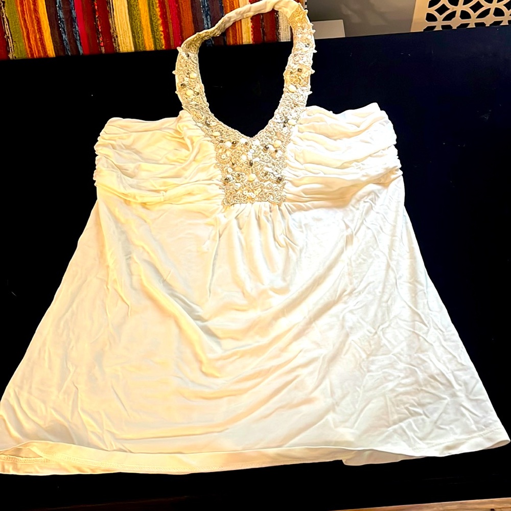 Cream halter top. Soft with beading details.